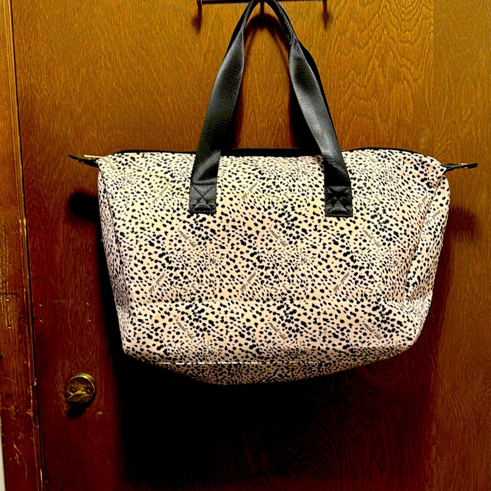 Mali and Lili canvas tote has outside zippered pocket as well as inside pocket.